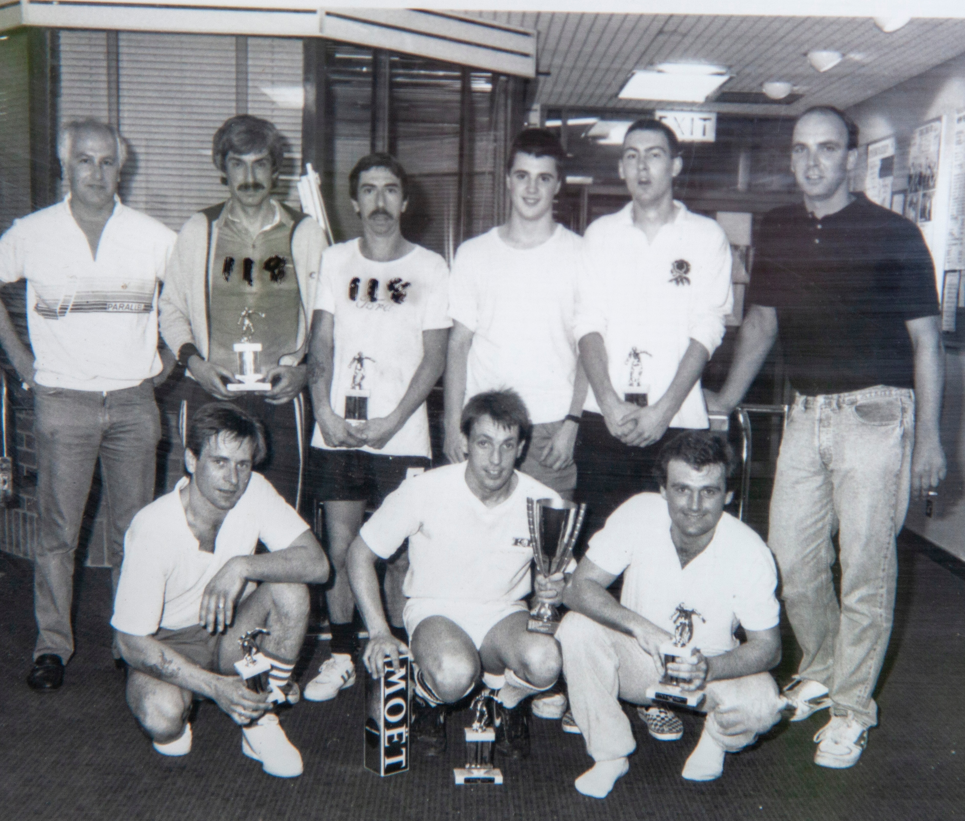 Eddie (second from left on back row) celebrating football success with former colleagues